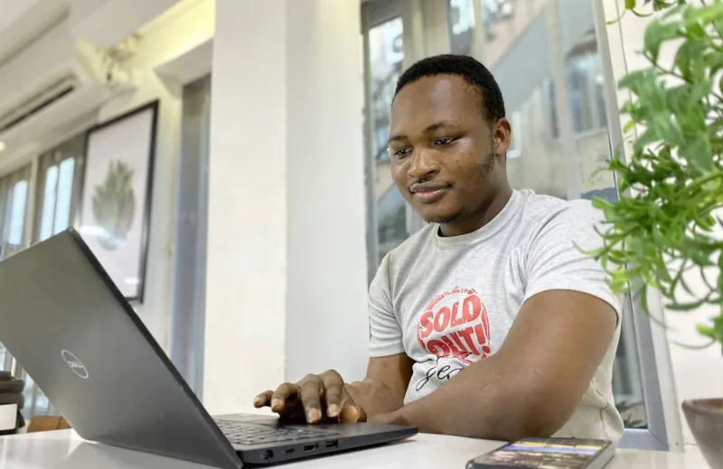 A man working on a laptop at a desk